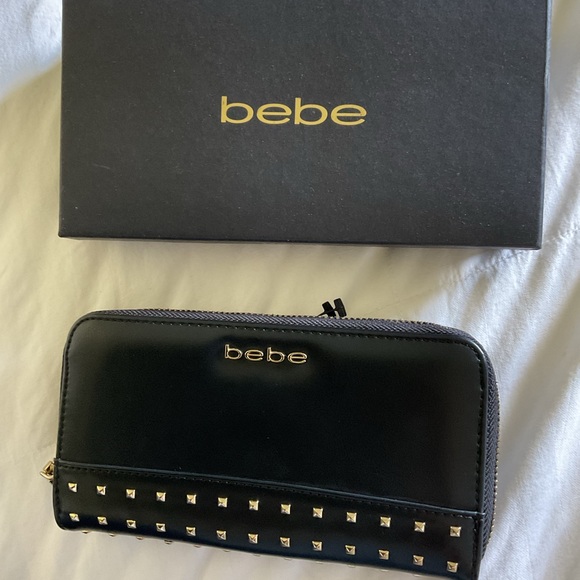 bebe Accessories - NWOT Bebe Black zipped with gold trim wallet with box